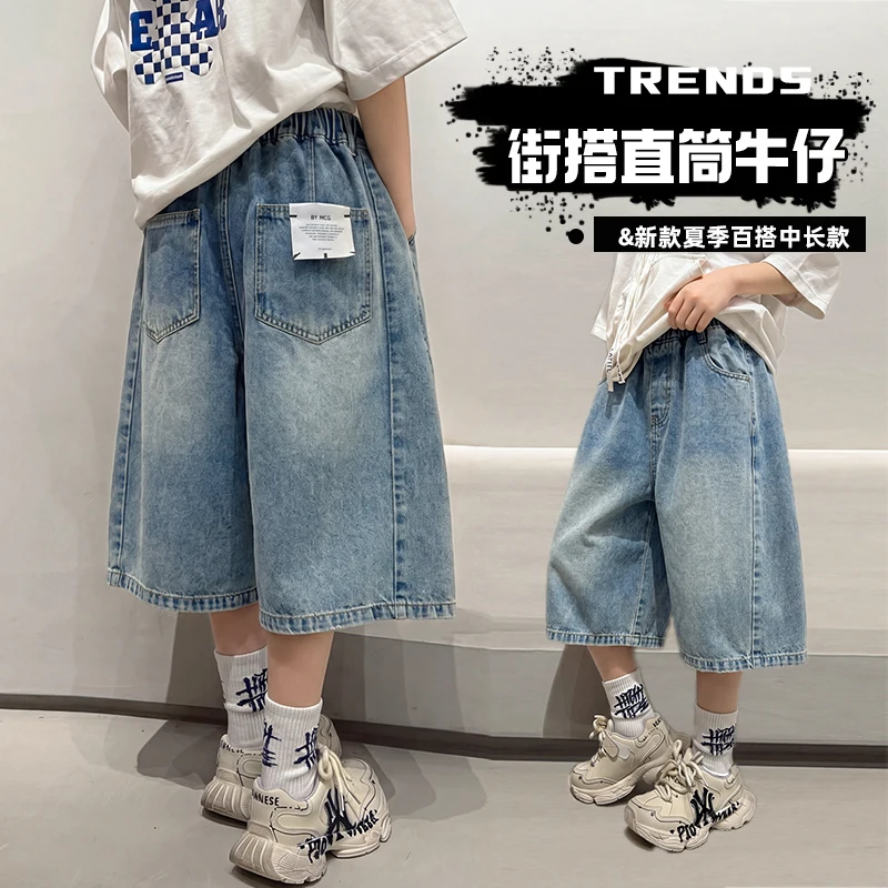 

Spring Summer Boys Blue Denim Jeans Loose Fit 3/4 Length Casual Fashion Toddler to Teen Jeans with Label Decoration Ages 4-14Y
