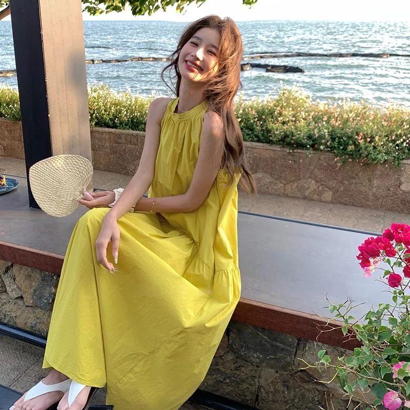 Yellow sleeveless halter neck holiday style loose evening dress