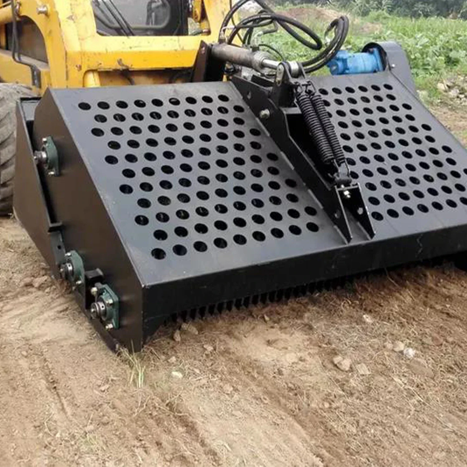 Skid steer loader attachment landscape rake