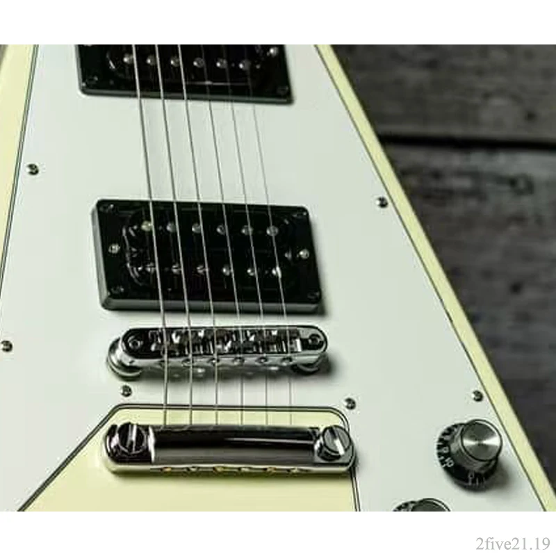 70s-era angular V profile solid electric instrument, clean ivory finish, dual humbucker set