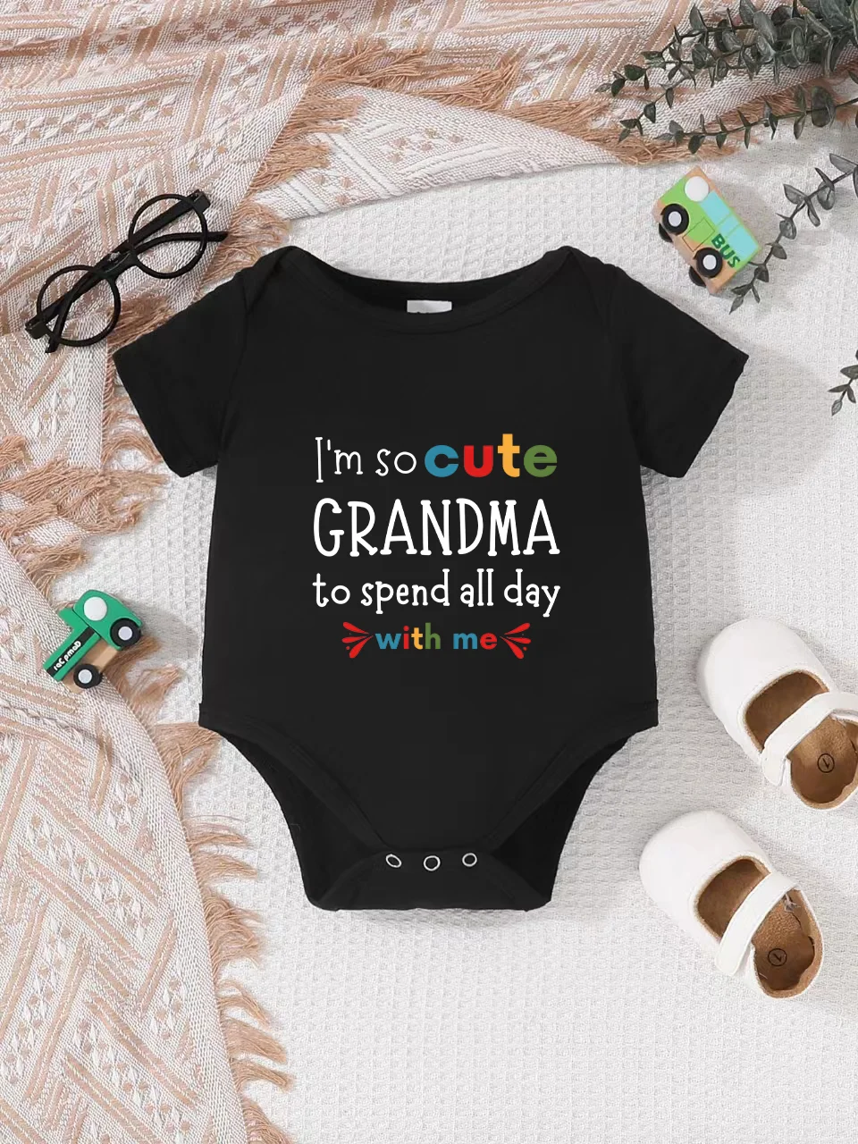

Playful letter-printed baby short-sleeve triangle bodysuit. Button closure for easy dressing