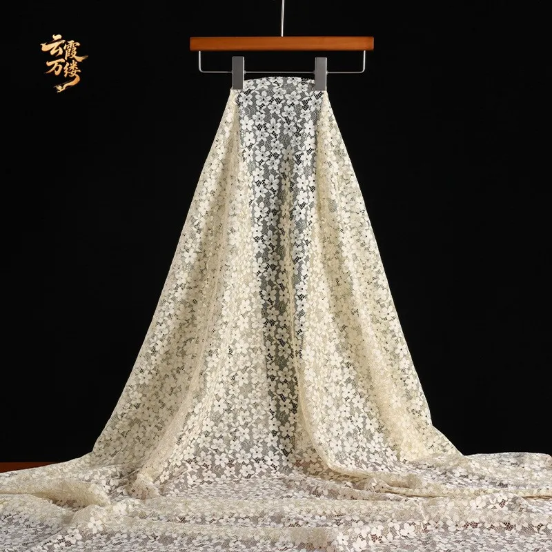 Apricot-colored lace mesh fabric with soft edges suitable for background decoration of formal gowns and cheongsams