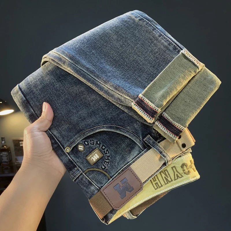 Luksusowe jeansy męskie na jesień i zimę, grube, elastyczne, w stylu retro, niebieskie, z wąską nogawką, lekko rozszerzane męskie spodnie.