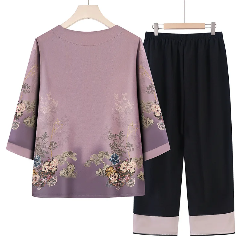 A Light Purple Women's Two-piece Set Featuring A Chinese-style Short-sleeve Blouse Paired with Ankle-length Pants.