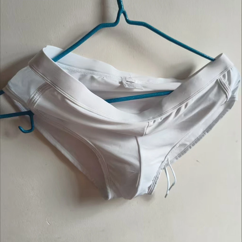 Solid color mesh triangle swimming trunks on both sides, nylon solid color low-rise swimming trunks, cross-border swimwear 10119