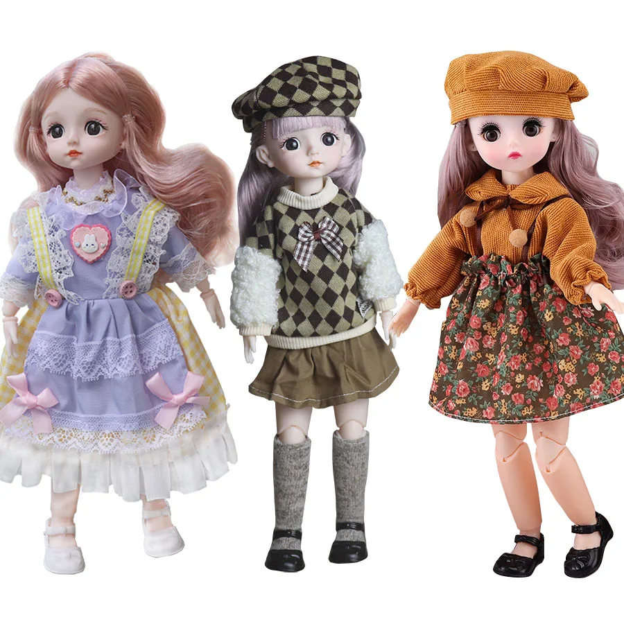 魅力的な28cmの人形は素敵な服を着ています。6歳から10歳の女の子にぴったりの玩具です。BJD人形用の1/6スケールの衣装が付いています。