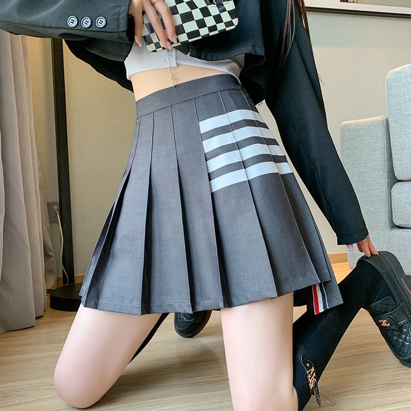 

Корейская юбка трапециевидной формы с высокой талией и четырьмя полосками спереди Ort Ba Длинная универсальная утягивающая юбка F-длины JK для молодых женщин