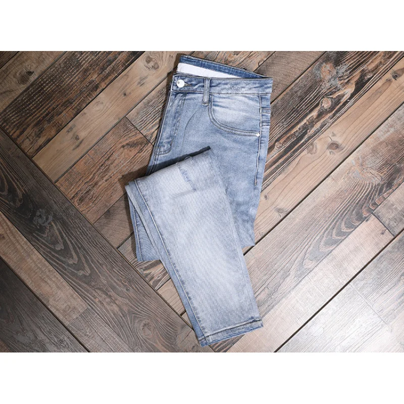 Light colored casual jeans for men, slim fit with small feet and elastic Korean style trendy and versatile casual ripped pants