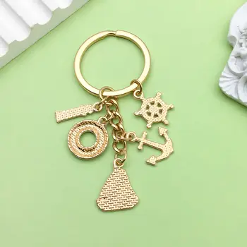 1個琺瑯航海主題鑰匙圈,合金材質,包含帆船、燈塔、錨、救生圈等設計元素,適用於車鑰匙、背包、錢包等。 8 最佳銷售 錨形鑰匙扣 - №5