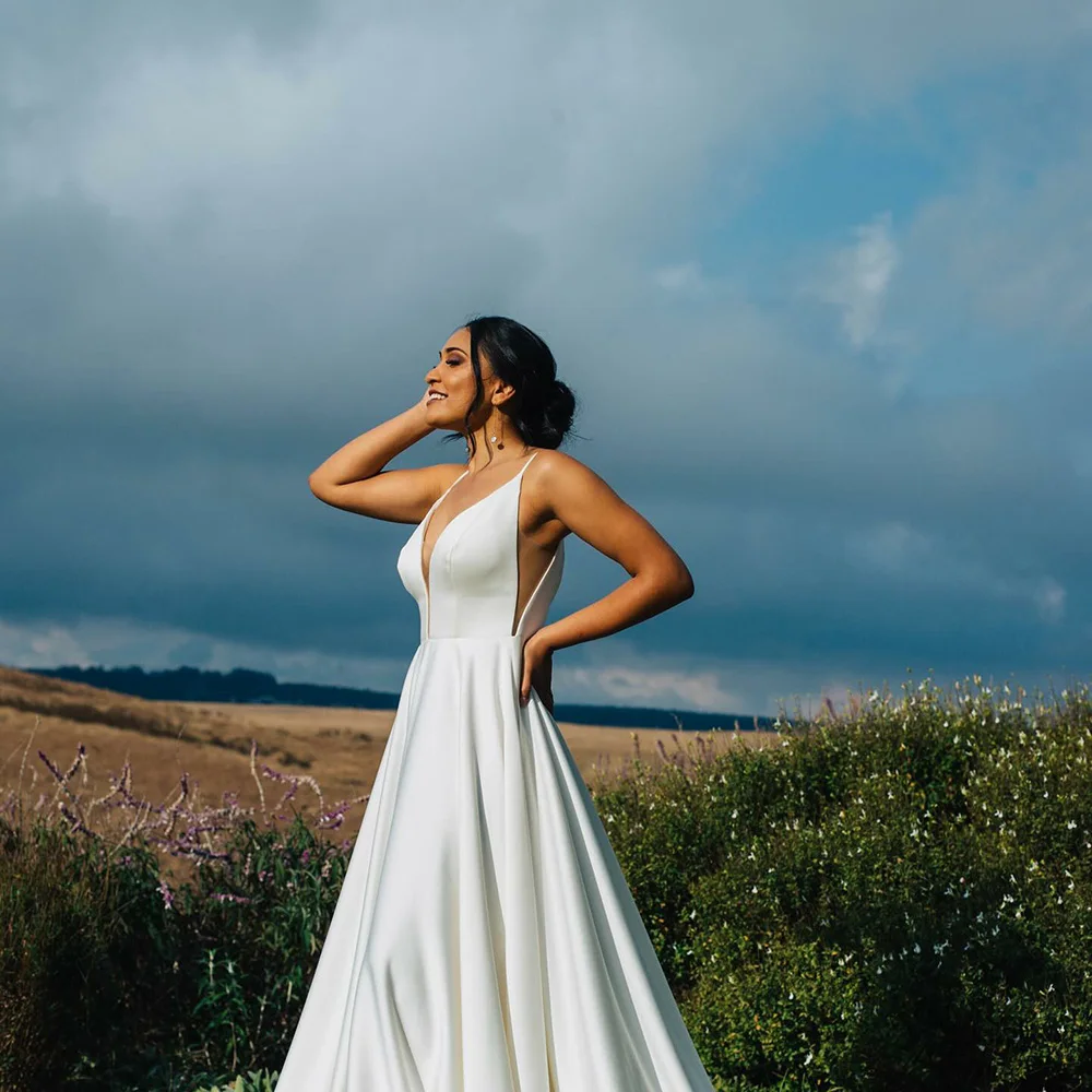 2025 Satin Wedding Dresses Deep V Neck A Line Backless Sexy Spaghetti Strap Bridal Gown Outdoor Women Bride Dress Customized