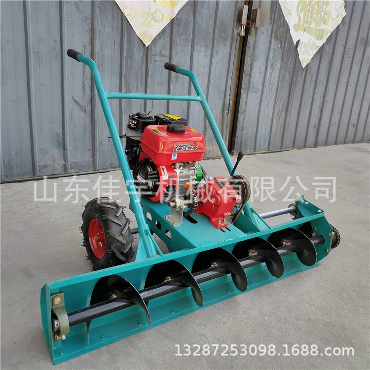 A small snow plow pushed by hand on a school playground