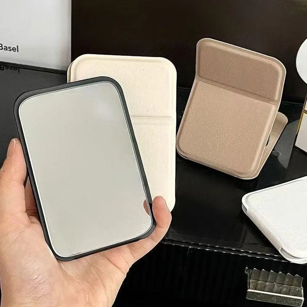 Espejo de maquillaje plegable de alta calidad, espejo de maquillaje portátil, espejos de maquillaje de pie de escritorio de Color sólido creativos de un solo lado para mujer