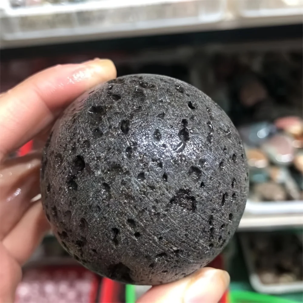 A volcanic rock crystal ball—a solid volcanic rock specimen with lava flow patterns, suitable for home decoration, collection