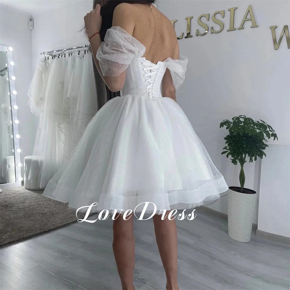 Love Sweetheart con spalle scoperte Tulle scintillante Tulle A-Line Abiti da sposa Elegante lunghezza al ginocchio Backless Lace Up Personalizzato