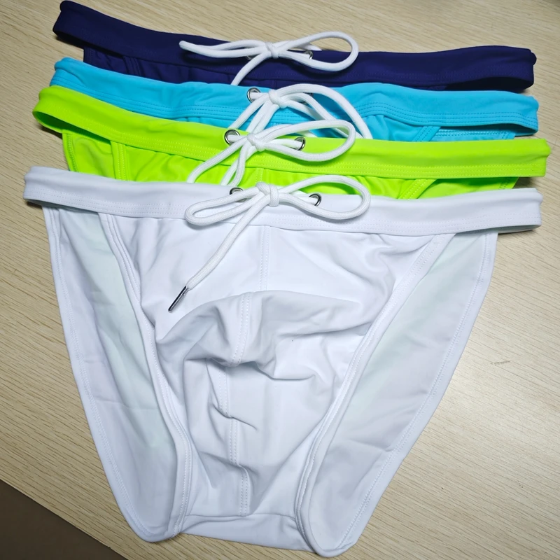 2026New s slender waist men's swimming trunks foreign trade triangle swimsuit European and American new fashion D101