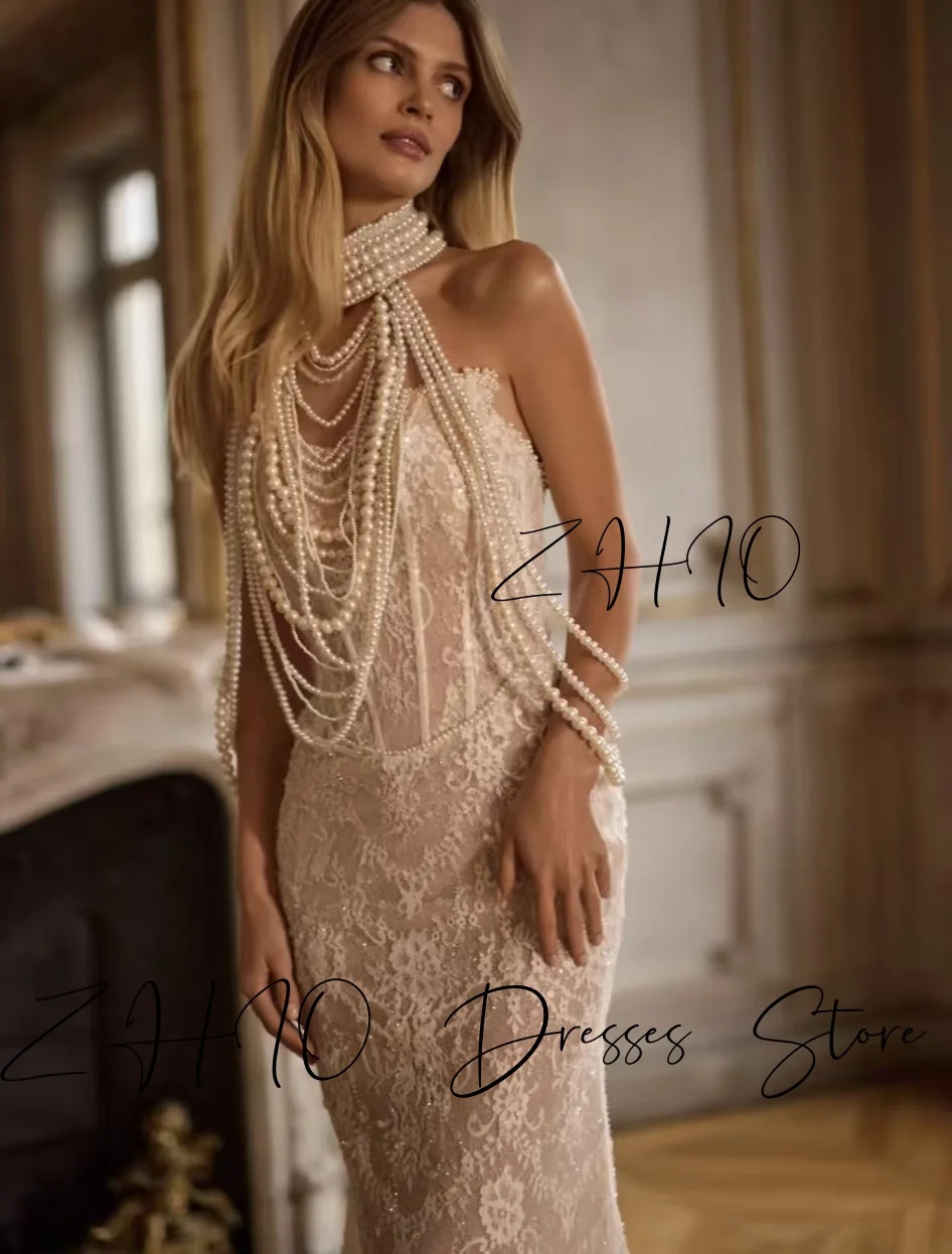 ชุดแต่งงานหรูหรา ZHIO ประดับมุก คอร์เซ็ทแบบผูกคอ ทรงเมอร์เมด ชายกระโปรงยาวลากพื้น สีไอวอรี่ ผ้าลูกไม้ ชุดราตรีเจ้าสาว สามารถสั่งตัดได้