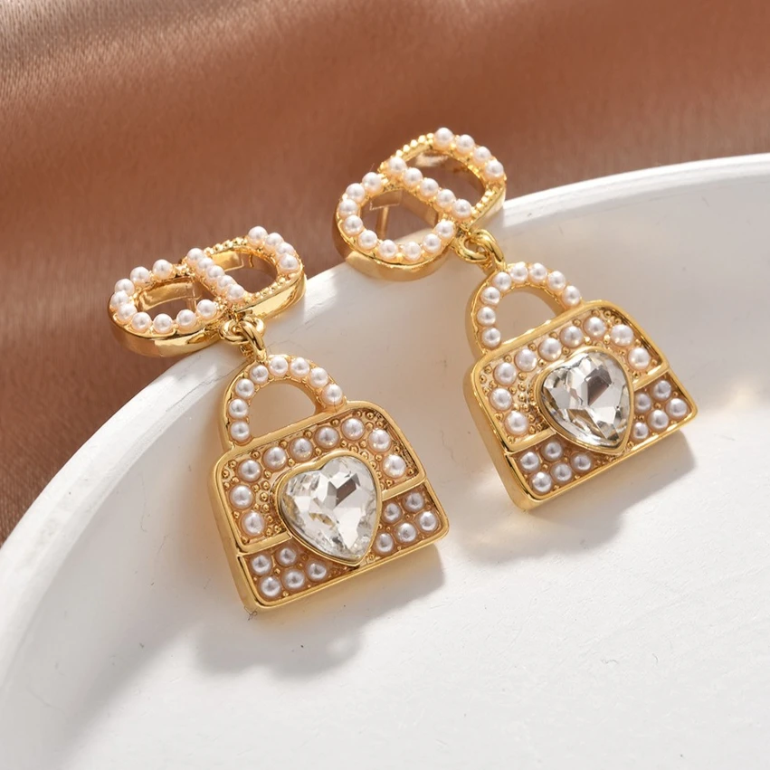 

Европейский и американский стиль, модный и универсальный классический дизайн сумки-гвоздики со свиным носом, высококачественные серьги для девочек