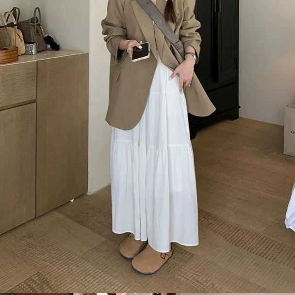 กระโปรงมิดิสีชมพูสําหรับผู้หญิงในฤดูใบไม้ผลิและฤดูใบไม้ร่วงฤดูร้อน 2025new เอวสูงกระชับสัดส่วนกระโปรงยาวทรงเอกระโปรงเค้กขนาดเล็กและฟู