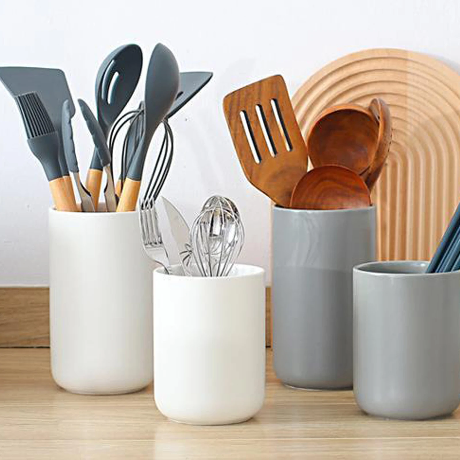 

Ceramic Utensil Organizer: Add a touch of classic simplicity to your kitchen with this sturdy, easy-to-clean utensil holder