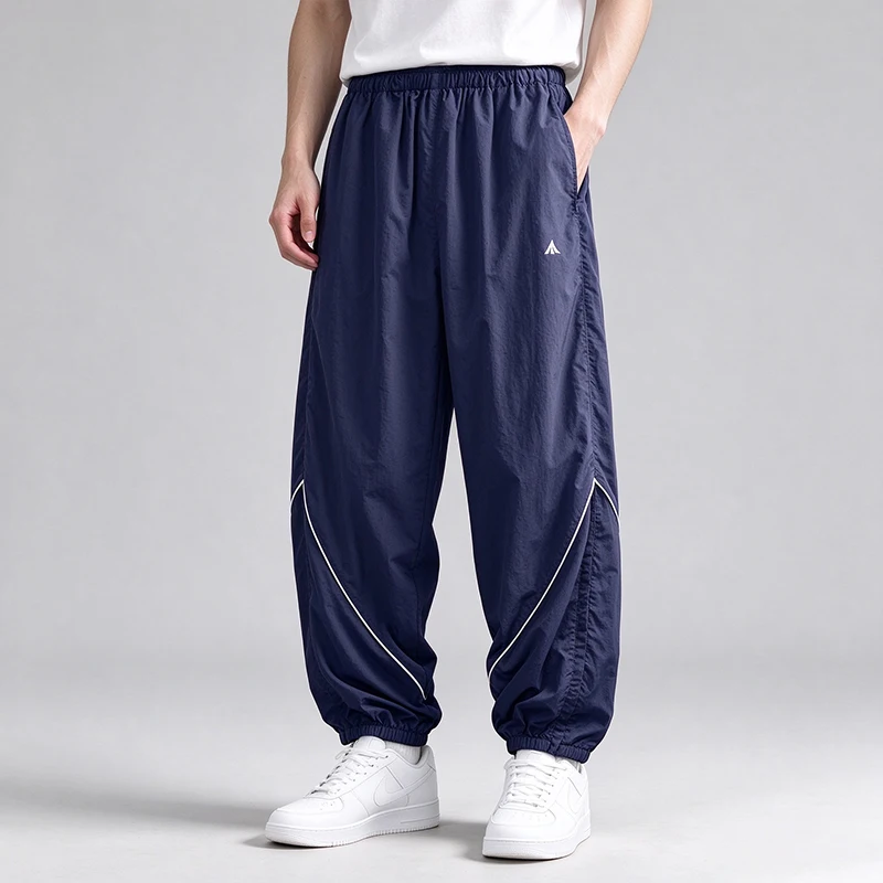 Leichte, schnell trocknende, lockere Nylon-Trainingshose für Herren, Jogginghose mit Kontrastbündchen und elastischem Bund, winddichte Sport- und Freizeithose im Streetwear-Stil. – Detail 6
