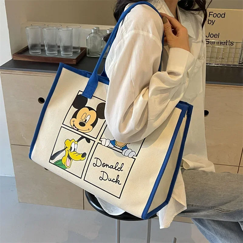 

Disney Mickey Mouse Cute Cartoon Large Capacity Shoulder Bag Women's 2024 New Canvas Handbag Travel storage bag