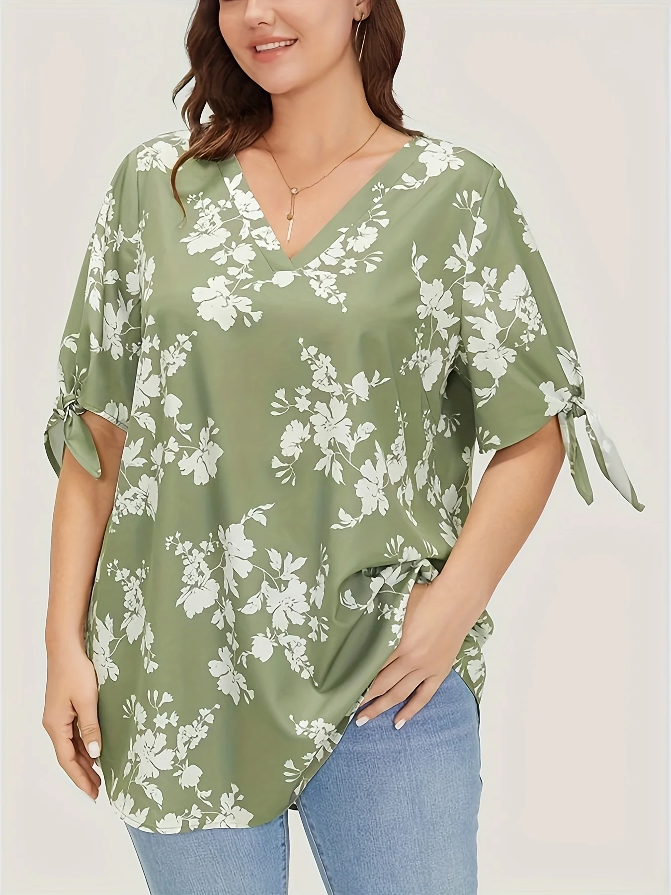 Plus size spring and summer light printed knotted V-neck shirt women's style loose version type office elegant temperament wear