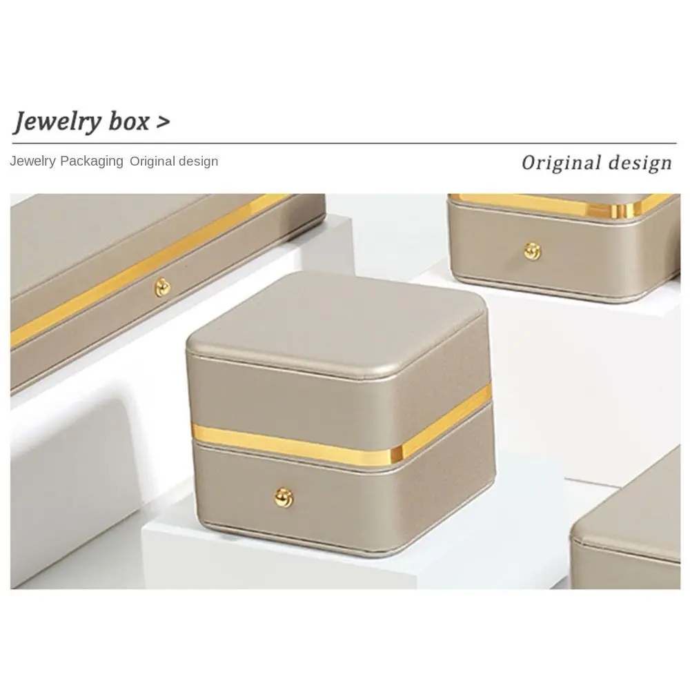 صندوق من الجلد الصناعي مربع الدائري ، مخملي أنيق متين ، صناديق عرض الحلقات الداخلية ، تغليف المجوهرات بتشذيب ذهبي ، تغليف الخطوبة