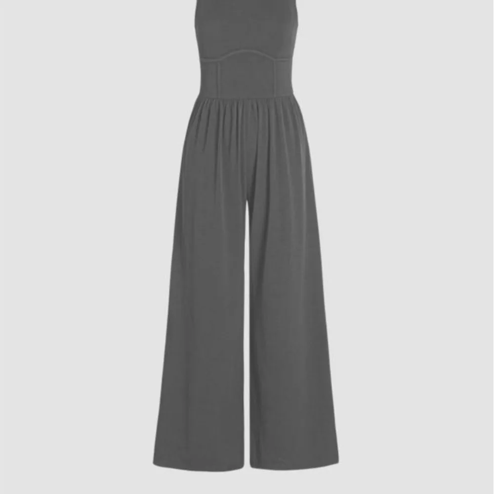 ملابس نسائية بذلة نحيفة عالية الخصر ورقبة دائرية وأرجل واسعة بدلة قفز للمرأة بلون سادة أنيقة بدون أكمام للتنقل