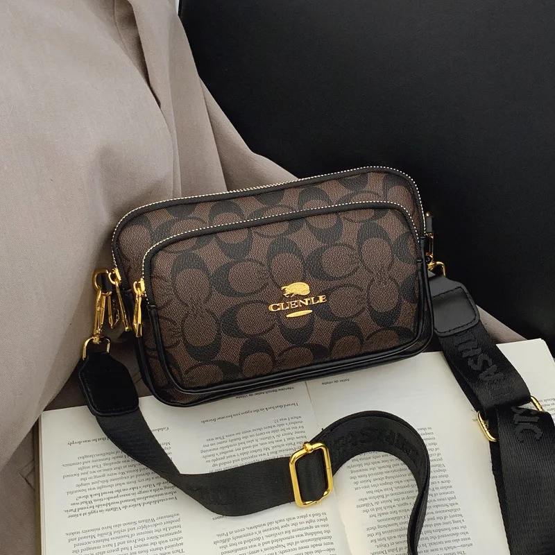 Original Circular-Pattern Logo Crossbody: Retro-luxury, durable fabric, adjustable strap. Ideal for daily.work/social use