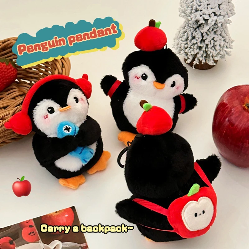 Apple Penguin Plush ของเล่นพวงกุญแจการ์ตูน Penguin ถือปลาตุ๊กตายัดไส้ตุ๊กตาจี้กุญแจรถกระเป๋าเป้สะพายหลังกระเป๋าตกแต่งเด็กของขวัญ