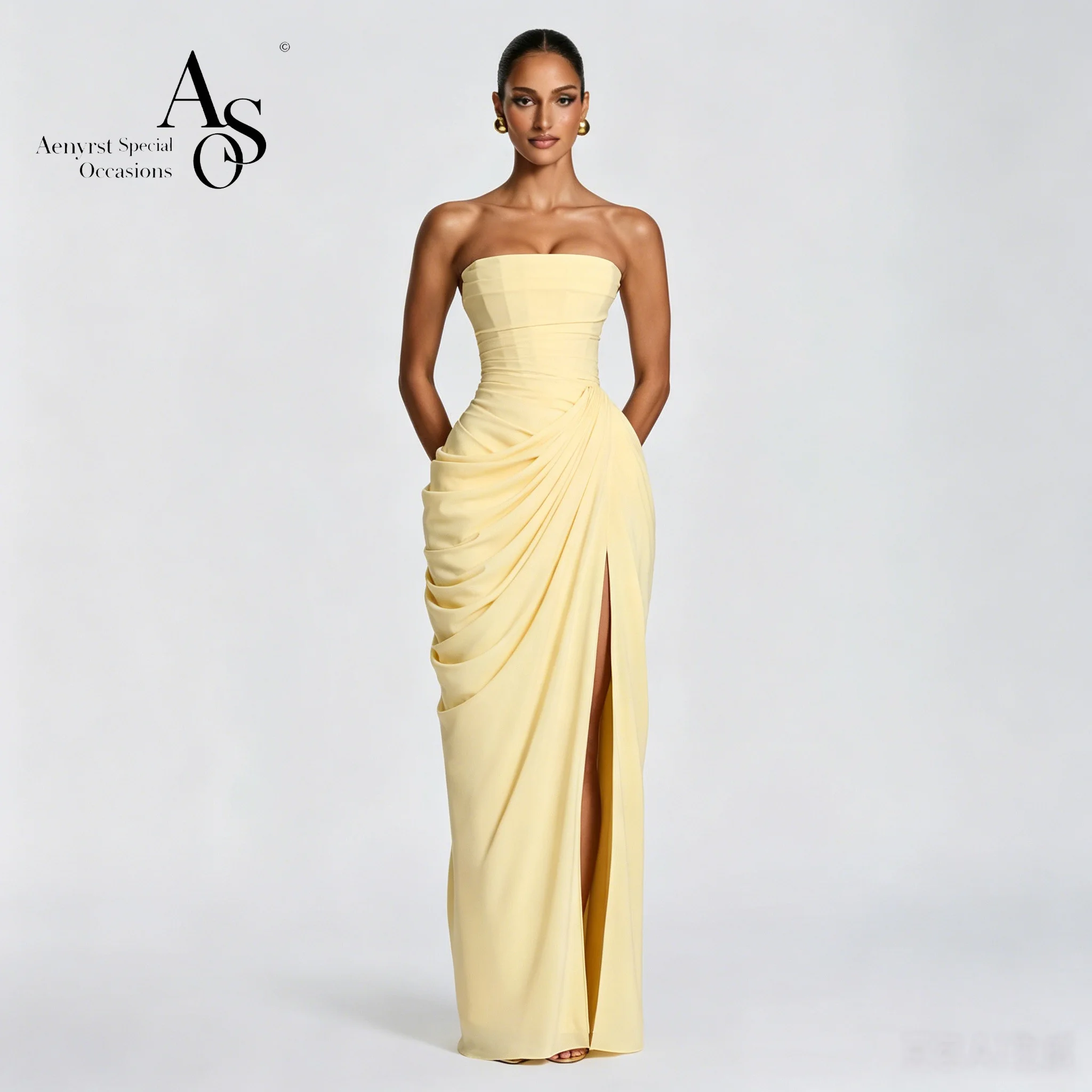 

Elegant yellow strapless sleeveless floor-length mermaid gown for formal occasions featuring ruching and a slit skirt