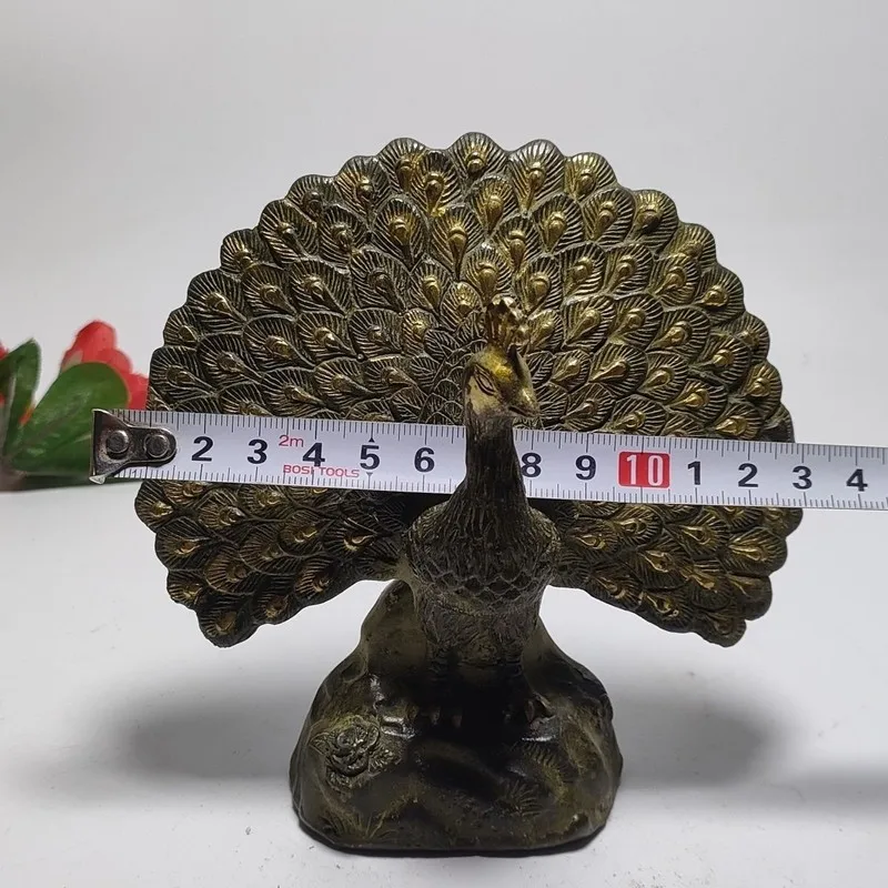 Copper peacock with its tail feathers spread, a gilded brass animal sculpture, a decorative piece for home or desk