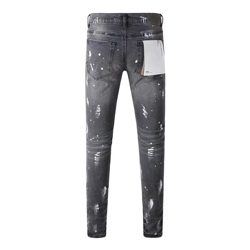 جينز رجالي من American High Street Fashion ذو ثقوب تالفة باللون الرمادي المتعثر على الجدران، جينز ممزق بأزرار قابلة للتمدد