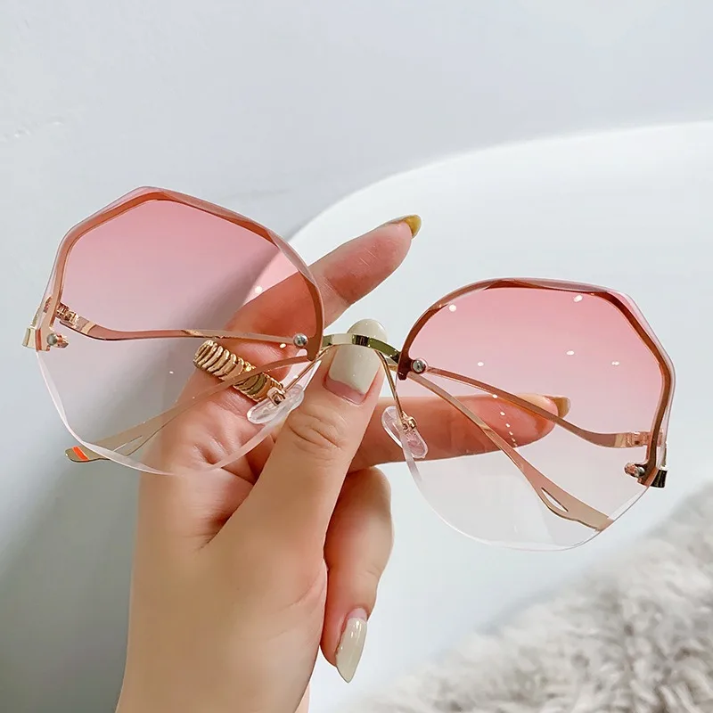 Trendy fashionable polygonal frameless cut edge sunglasses women metal curved legs retro street photo fashionglasses