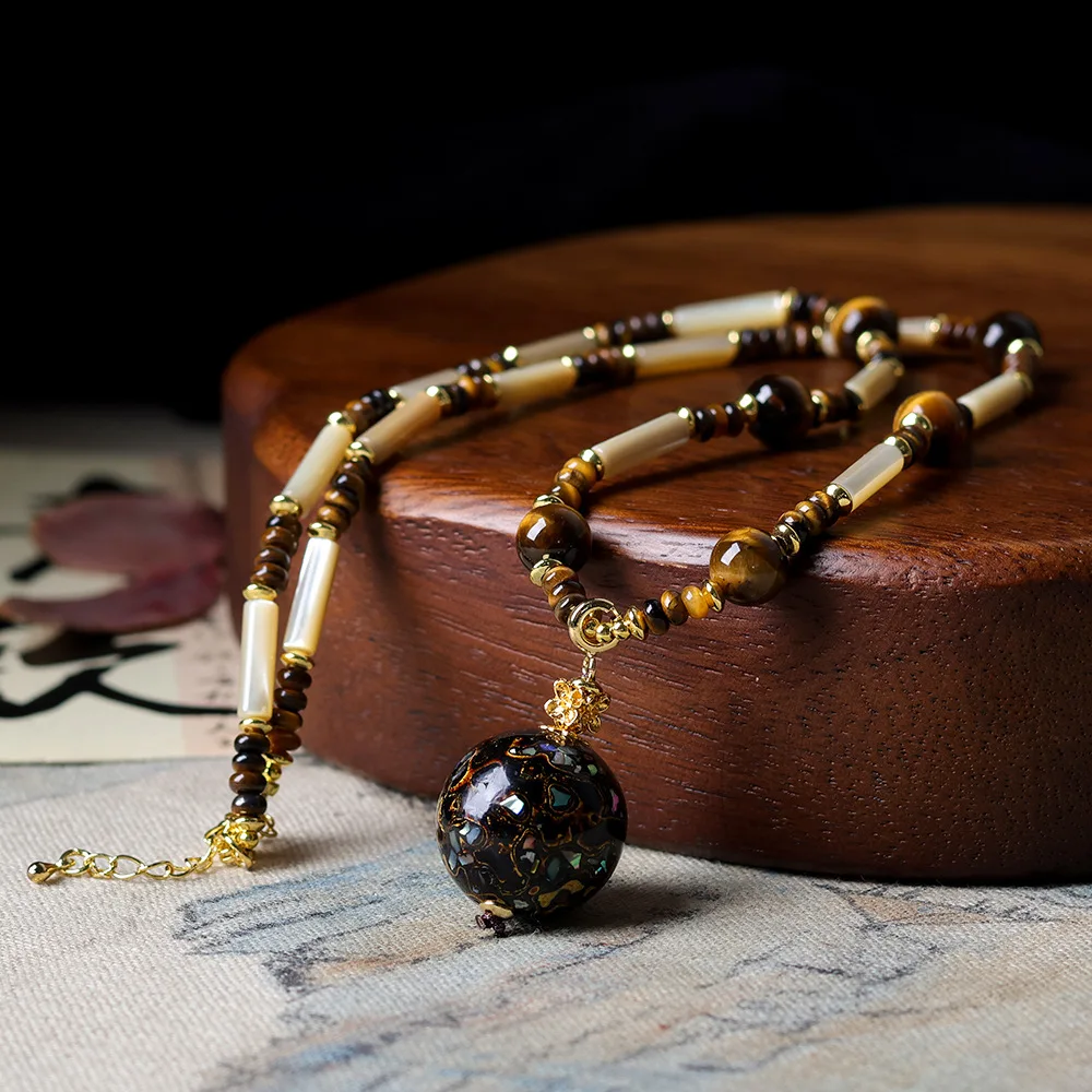 

Original tiger's eye stone with old fish bone hand-woven necklace Wenchuan large lacquer beads Chinese advanced jumper chain