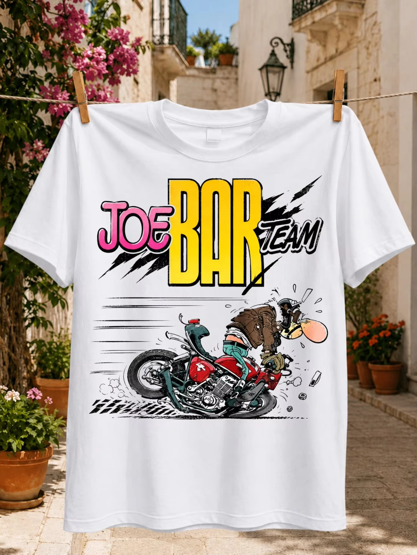 2026 Team Graphic cartoon biker losing control of a red motorcycle energetic comic road scene Unisex All T-Shirt