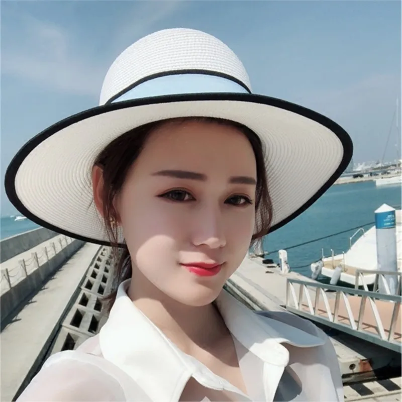 

Lady in a hat white top with wide brim for vacation by the seaside