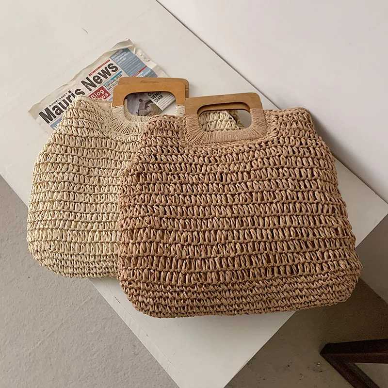 Borsa estiva in paglia intrecciata borsa con manico in legno femminile borsa da spiaggia da viaggio di grande capacità Totes stile moda scava fuori