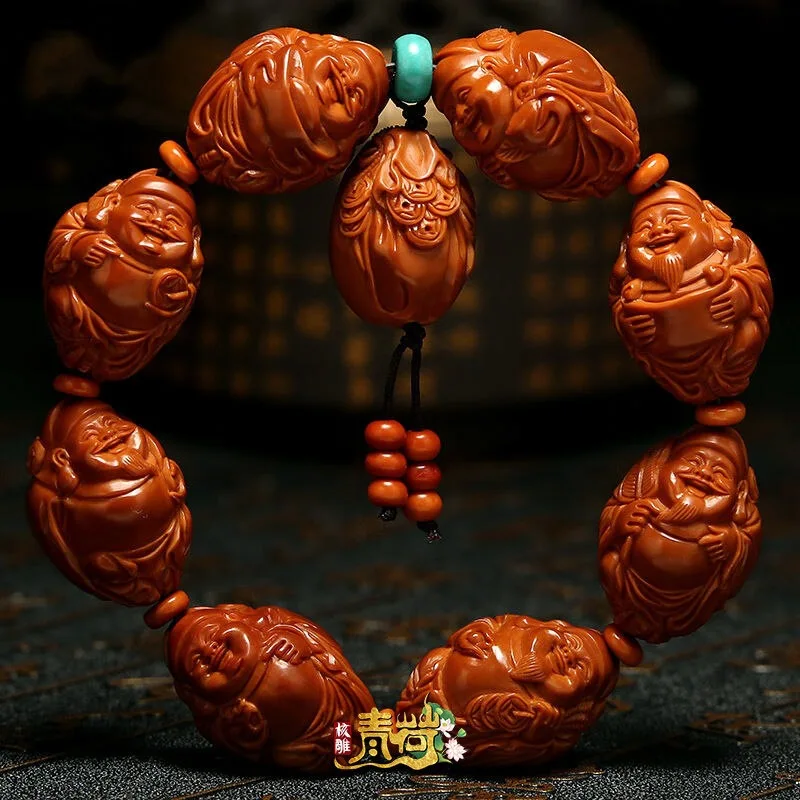 Olive bracelet, Happy Eight Treasures, 20 large   artfully carved pit beads