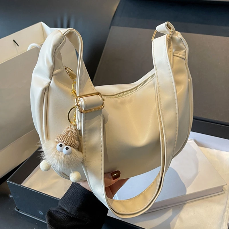 

Women's Crossbody Bag with White Coal Ball Pendant Solid Large Capacity Shoulder Bag with Adjustable Shoulder Strap