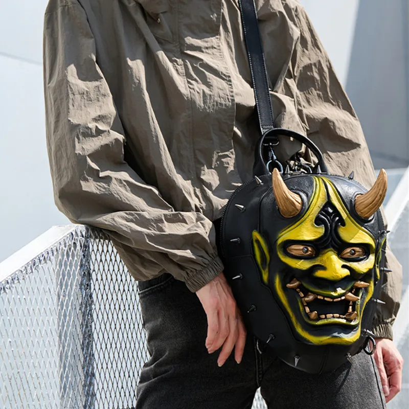 The New Personalized and Trendy Men's and Women's Backpack Features a Punk-Style Rivet Design in the Shape of a Prajna Mask