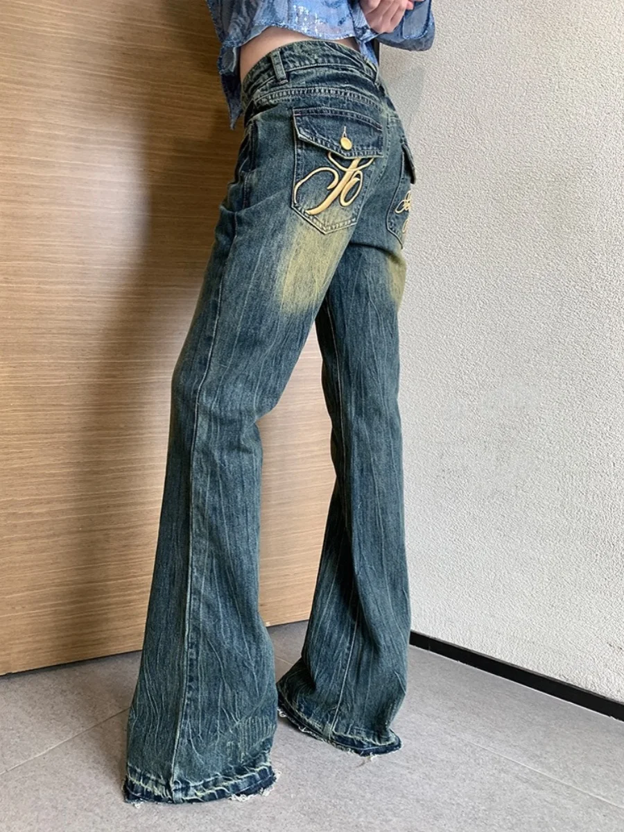 

Ripped Bell Bot Jeans Denim Pants Embroidered Lettering Worn-In Look High Waist Long Leg Zipper Closure Deep Blue Color