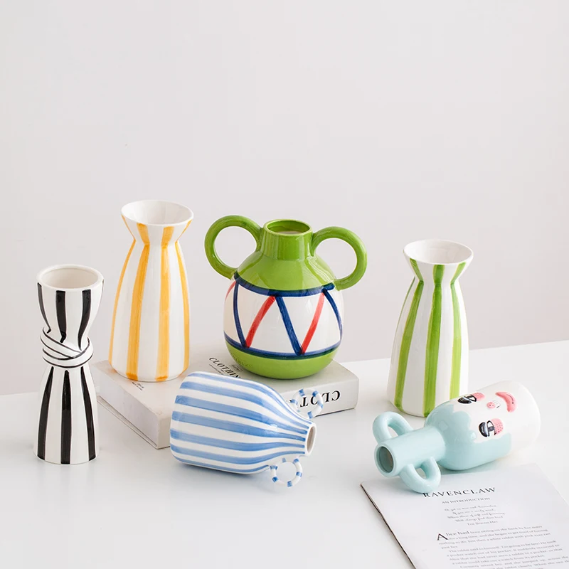 

Ceramic vase with creative hand-painted colorful stripes - an elegant decorative piece for flower arrangement