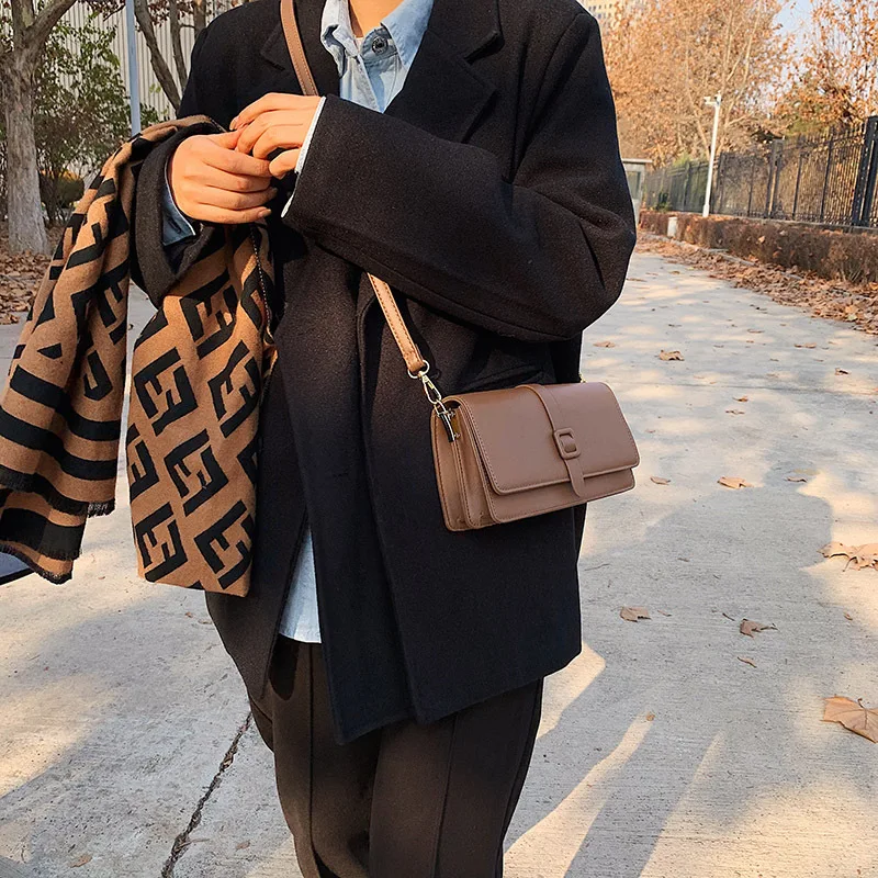 KK   2024 new handbag, women's new texture PU single shoulder crossbody bag, with a buckle armpit pocket niche design