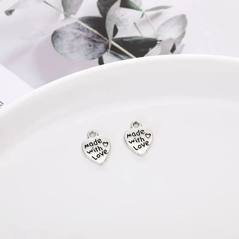 Elegant and niche retro alloy heart-shaped pendants, DIY fashion clothing accessories and antique silver and gold