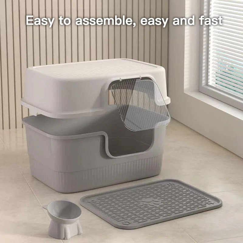 La grande caja de arena cerrada para gatos viene con cuchara, desodorante y estera para un fácil limpieza de inodoro para gatos cubierto