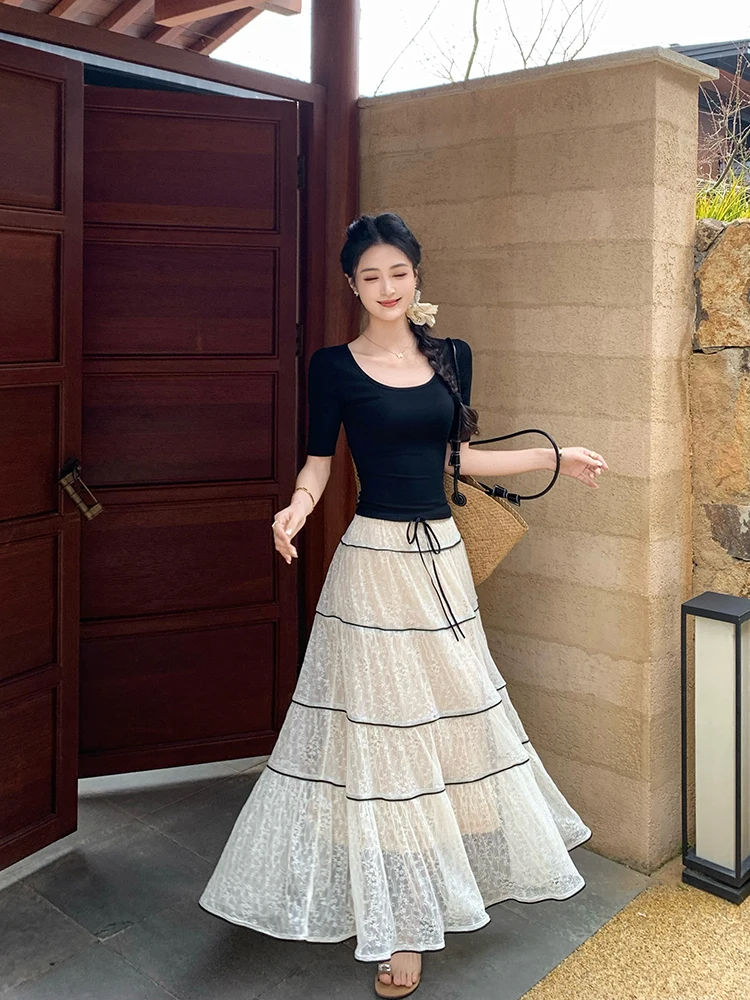 

Черный кружевной комплект Linyner: топ без рукавов с воротником-халтер и юбка, женский летний модный комплект из двух предметов для повседневной носки, стройнящий силуэт.