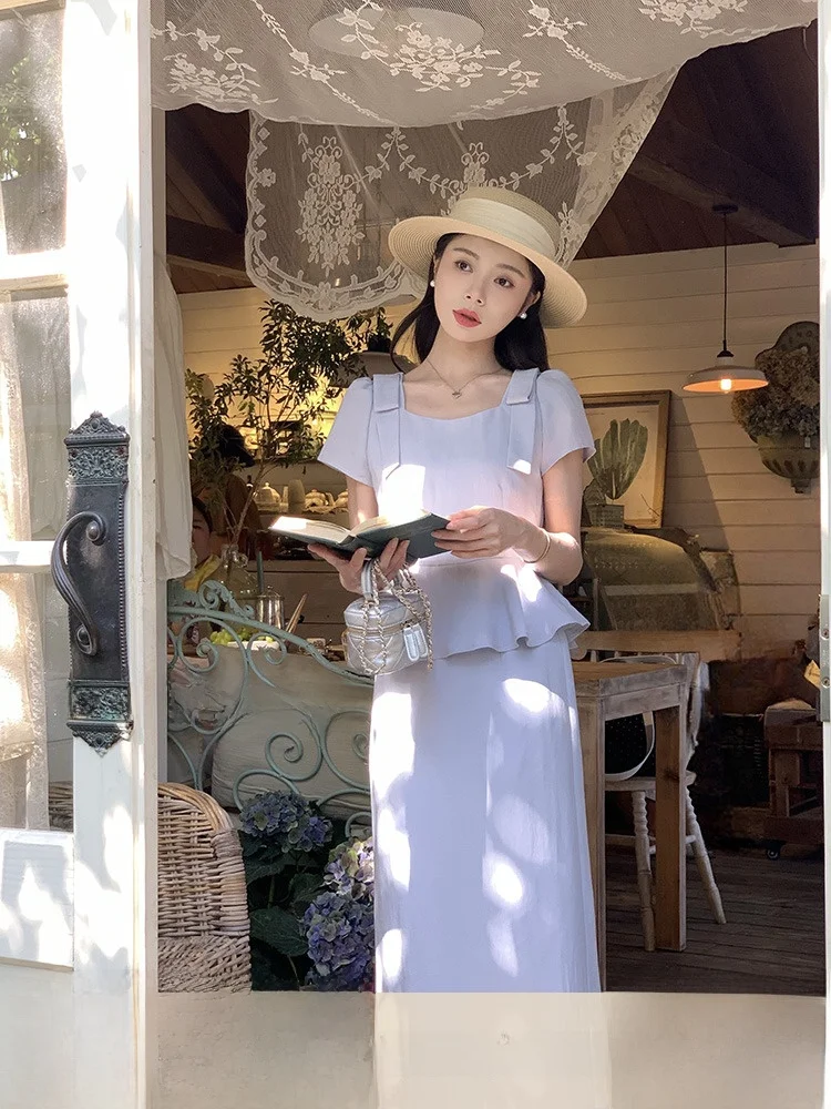 

Новинка! Модный женский комплект из двух предметов: топ с узлом и юбка. Лето 2025.