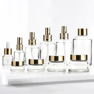 

whosesale high quality Round Shape skin care cosmetic packaging clear matte coloured glass cosmetic jars and makeup bottle set