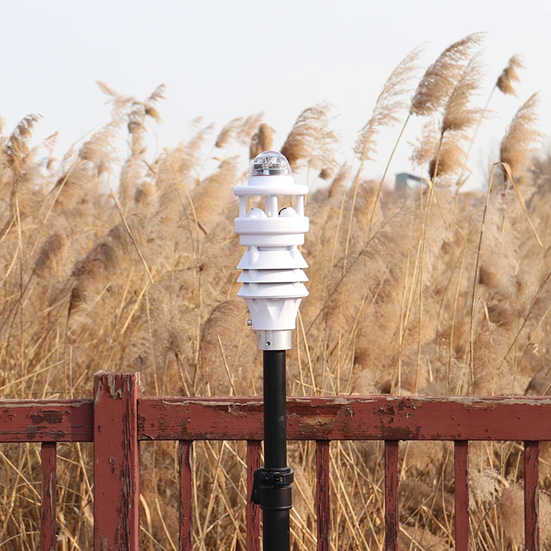 Solar-powered automatic weather stations with rain, wind, radiation, temperature, and humidity sensors for outdoor monitoring